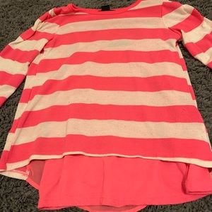 Pink and white striped shirt.